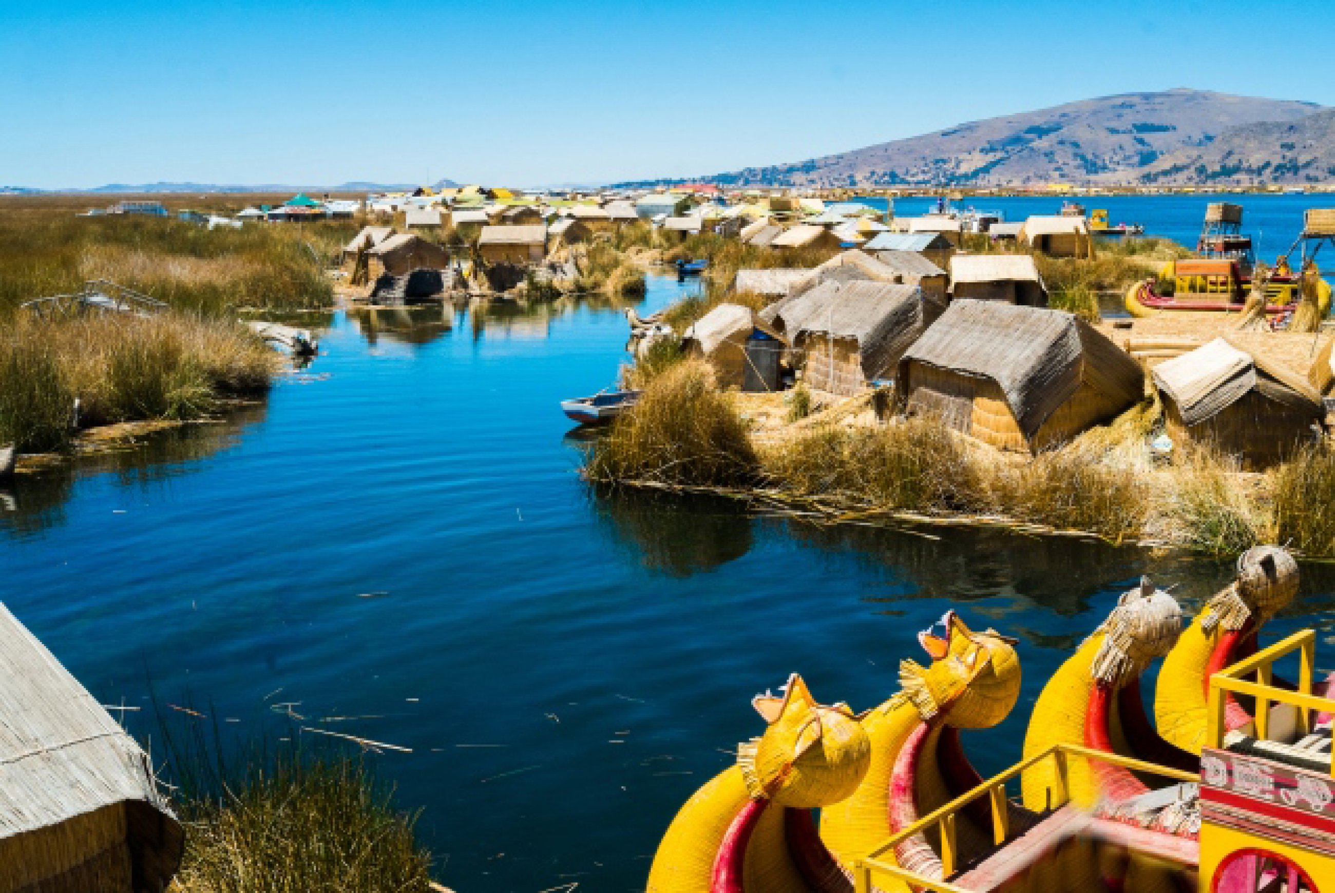https://bubo.sk/uploads/galleries/7430/view-of-uros-floating-islands-with-typical-boats-puno-peru.jpg